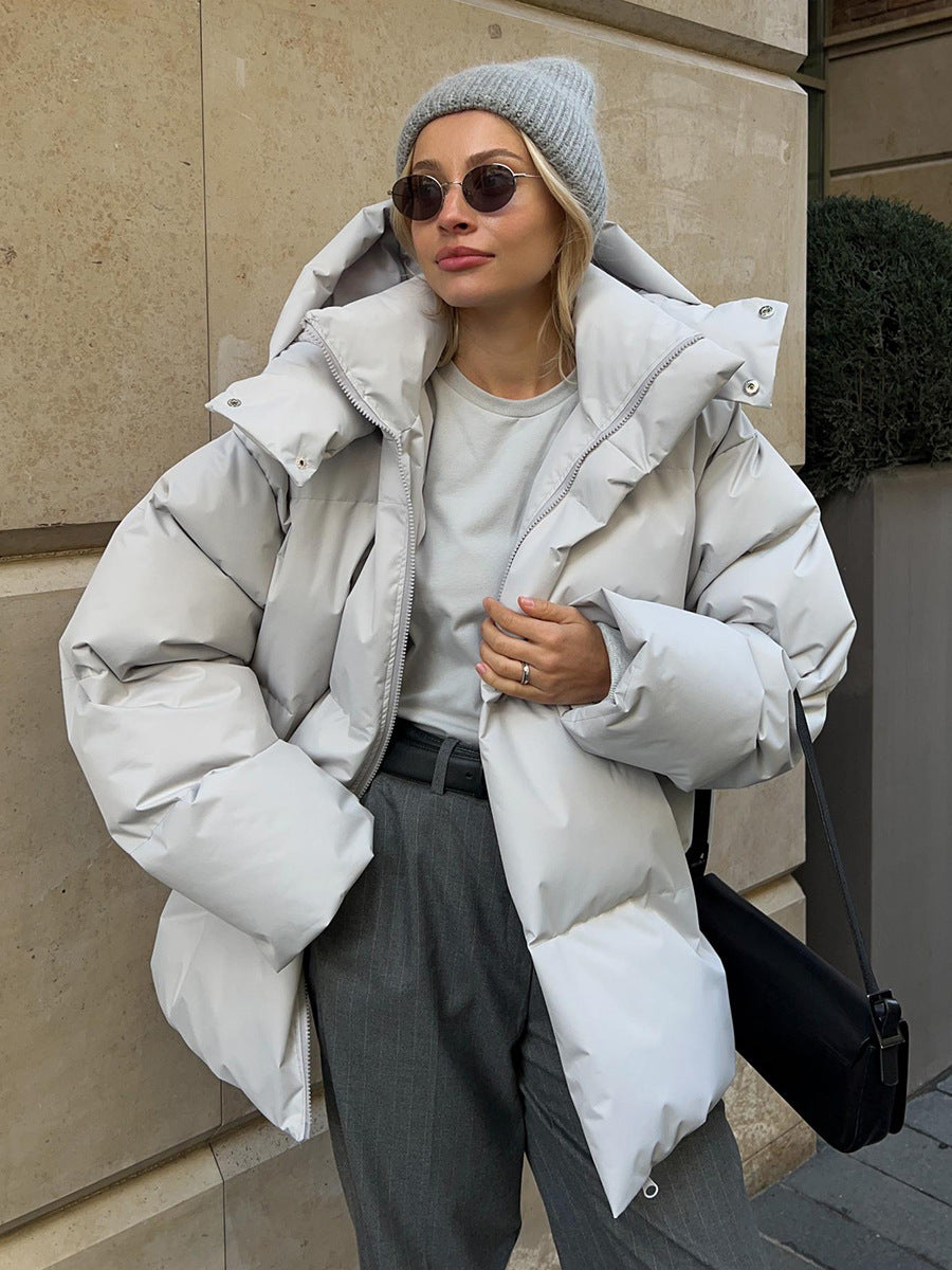 Doudoune oversized femme à capuche, col montant et poches 1