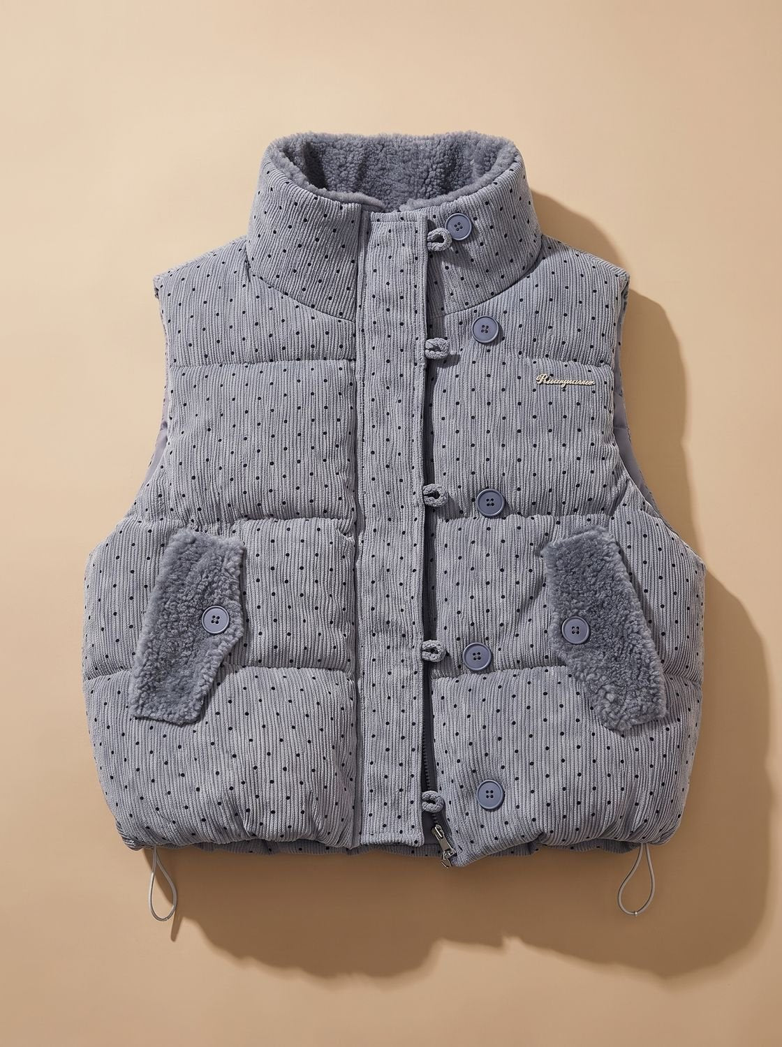 Doudoune sans manches femme col montant doublé peluche à pois 1