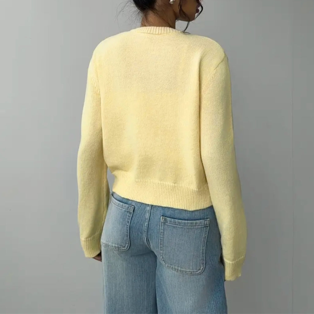 Gilet court femme boutonné à col rond en maille côtelée 11