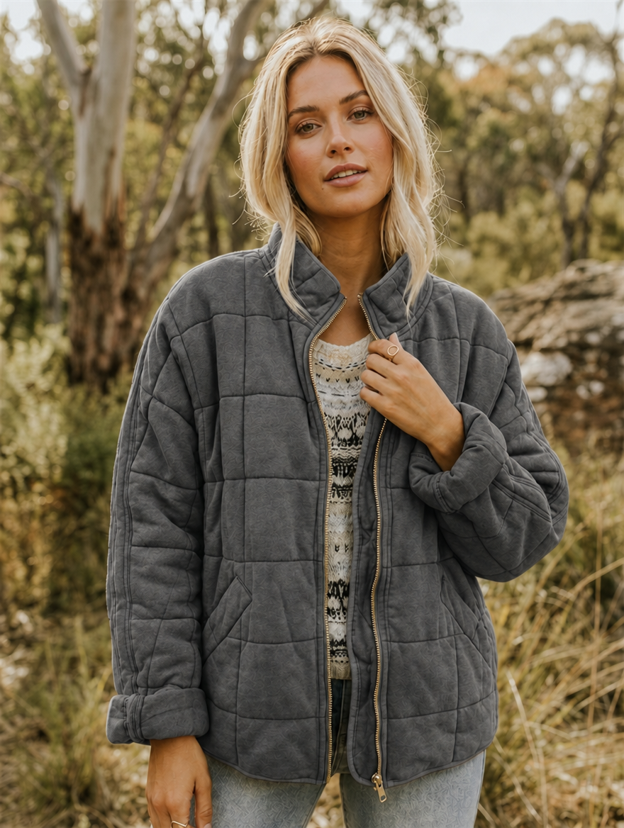 Veste matelassée femme oversize à col montant, fermeture éclair et poches 1