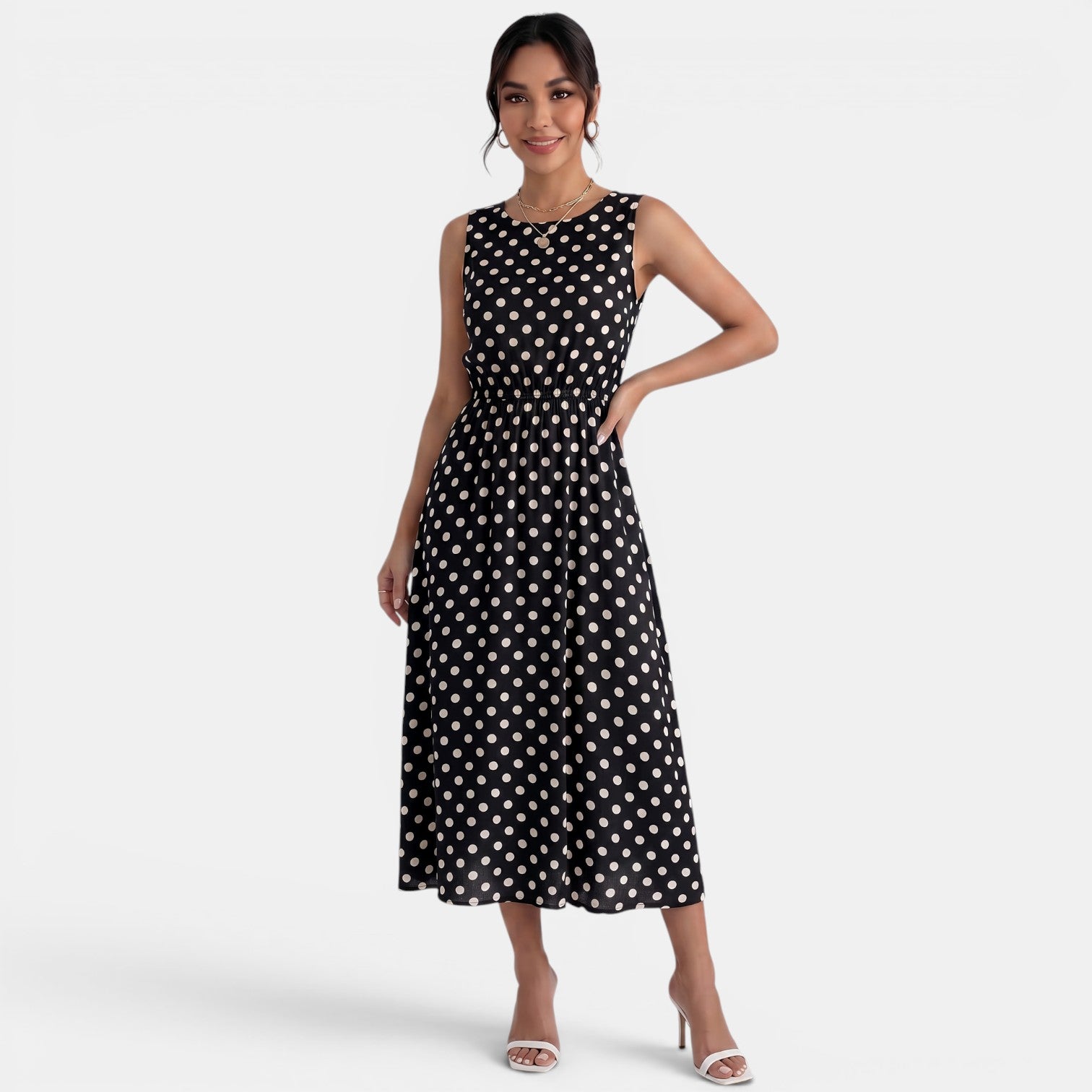 Robe midi à pois d'été sans manches à col rond et coupe trapèze